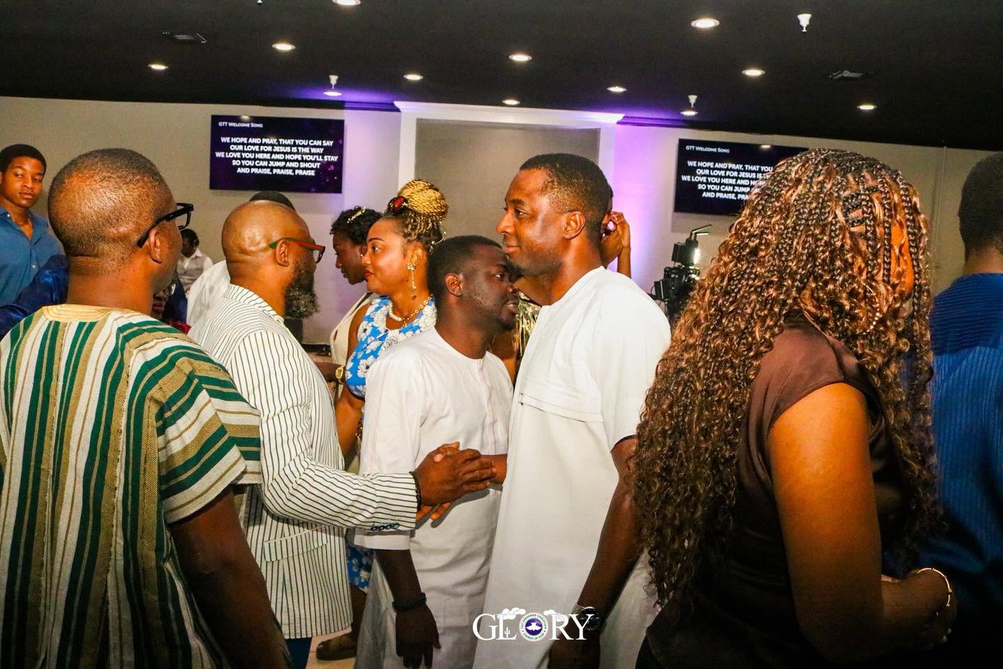 Members greeting one another in fellowship